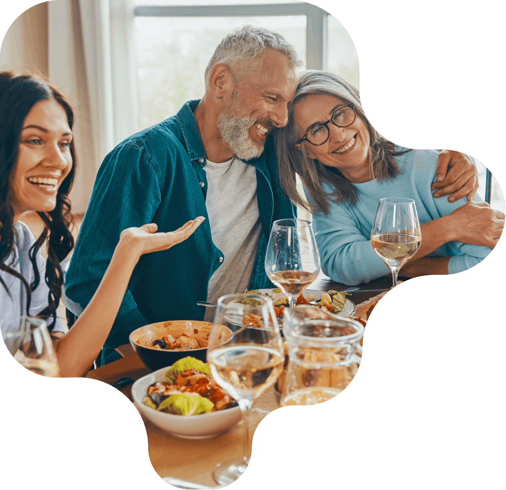 group of people sitting around a dining table