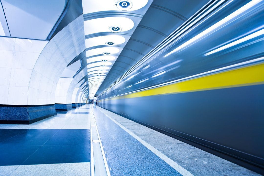 Subway tunnel with a train passing through at a high rate of speed