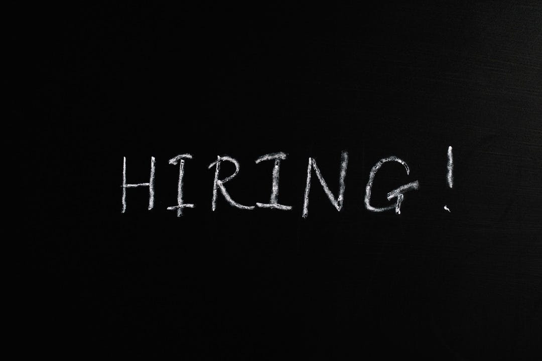 "Hiring" written in white on a black background