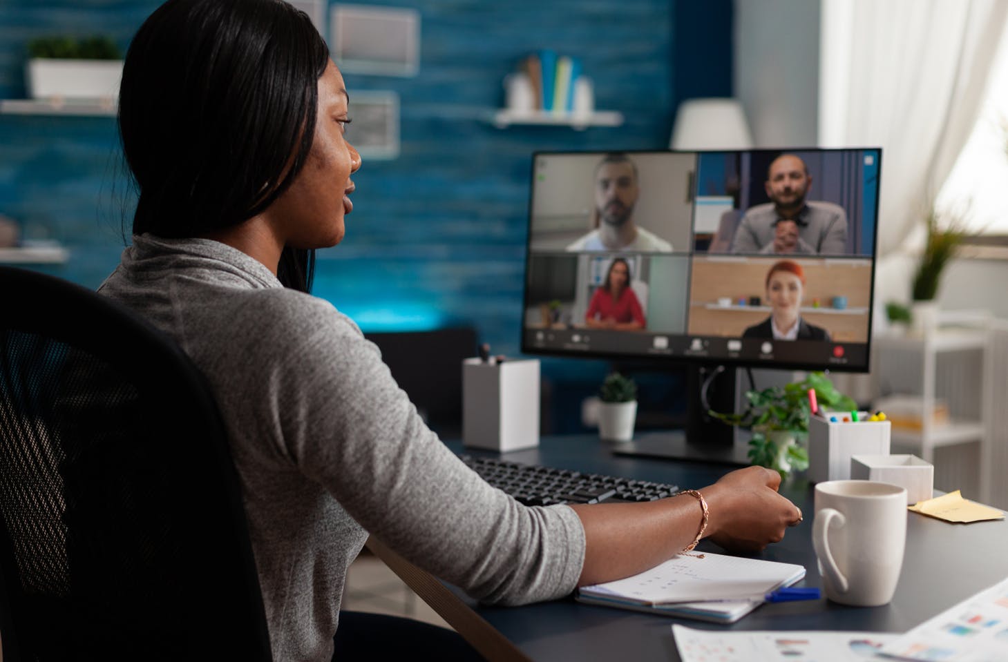 Remote worker on video call to discuss visa and immigration needs.