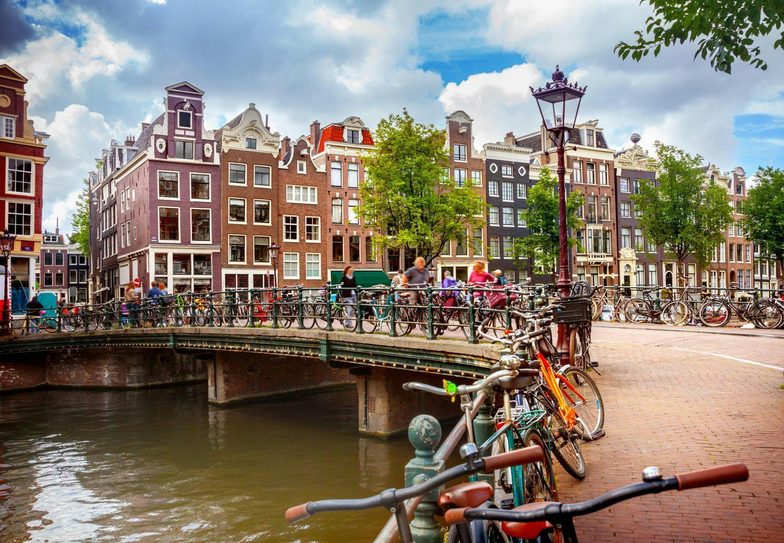 Bridge with bikes over a canal in Amsterdam