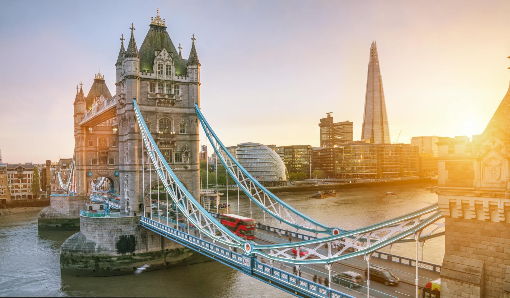 London Bridge at sunset with commuter traffic crossing the bridge