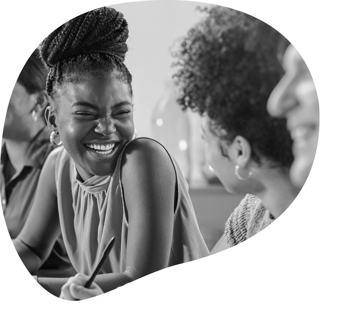 dark skin tone woman smiling at another woman
