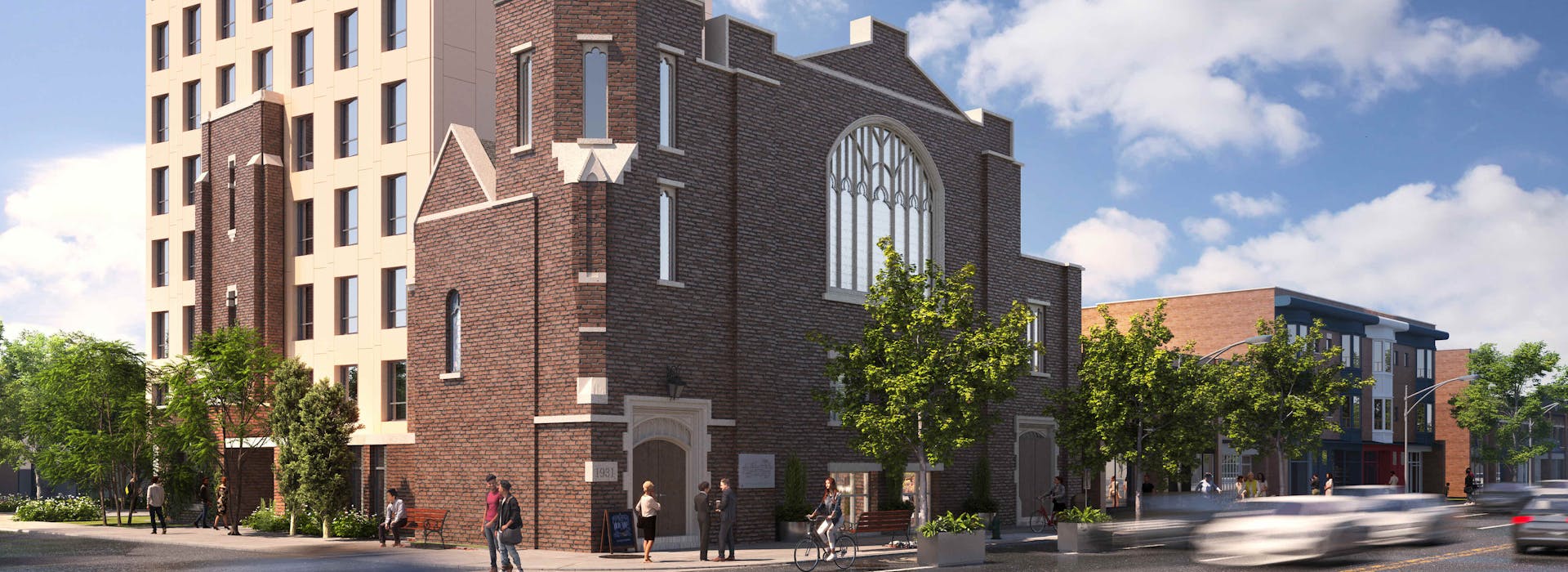 Modern multi-story building at 60 Bowden with a historic brick facade and large windows, set against a clear sky