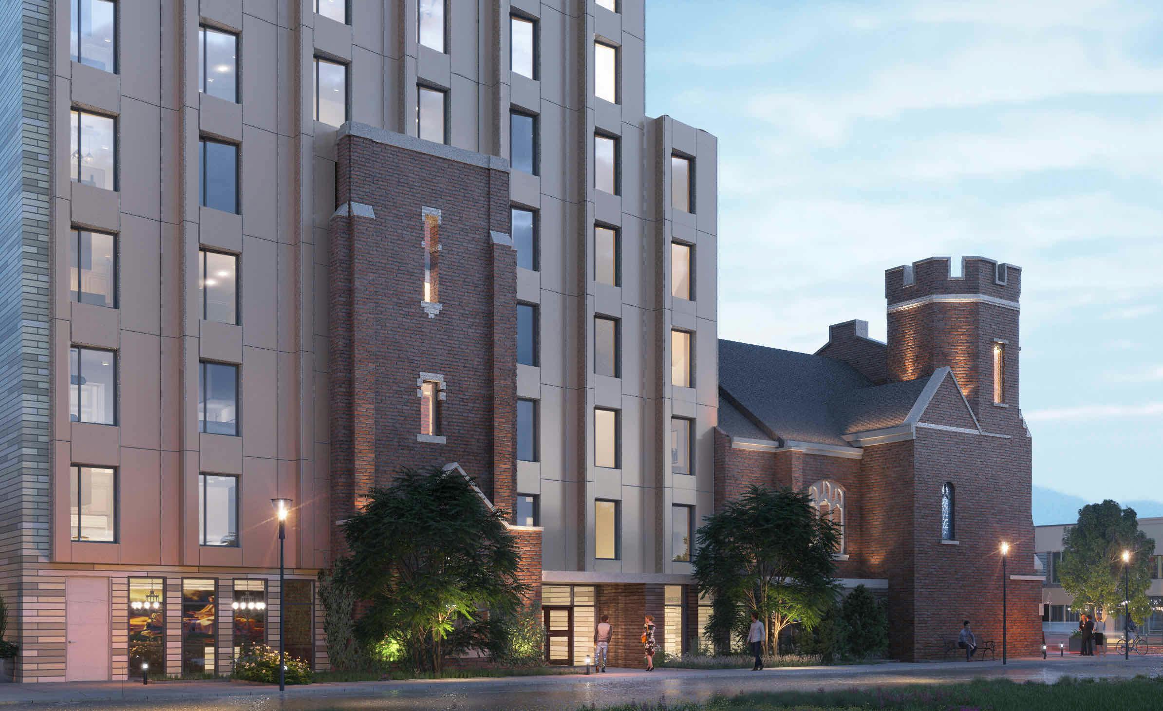 Evening view of 60 Bowden, showcasing its modern multi-story design with a historic brick facade and illuminated windows