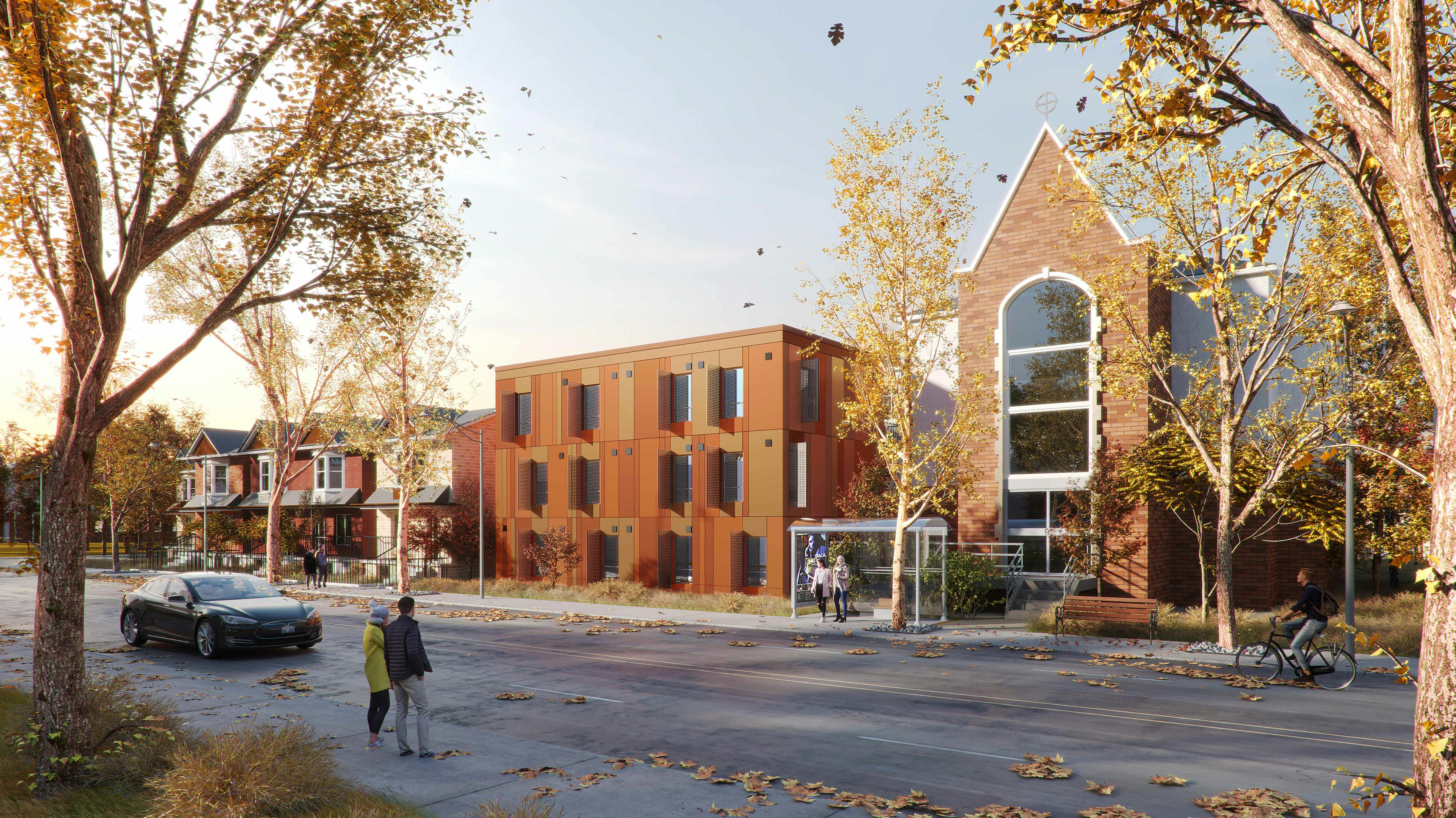 Street view of 1120 Ossington Ave, featuring a modern building with a brick facade next to a historic structure, surrounded by trees with autumn foliage