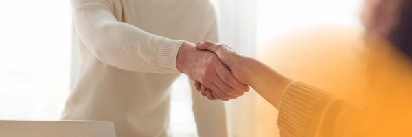 two people holding hands