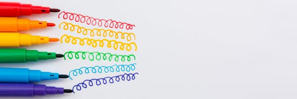Markers painting rainbow colours