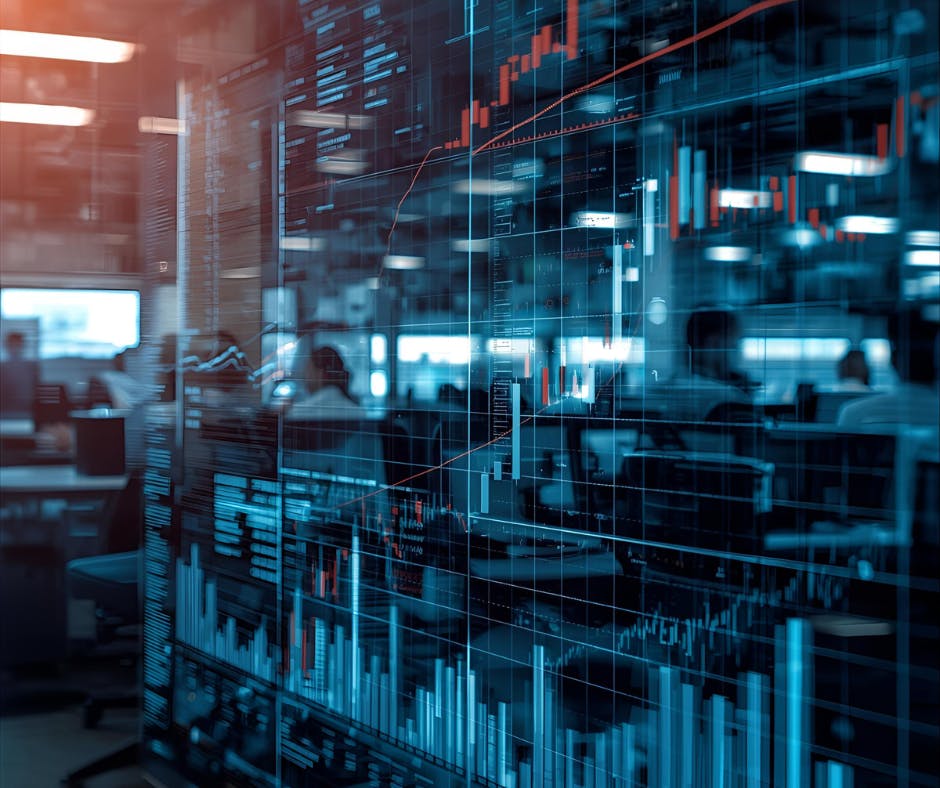 Graphs portraying financial markets on a glass office wall reflection