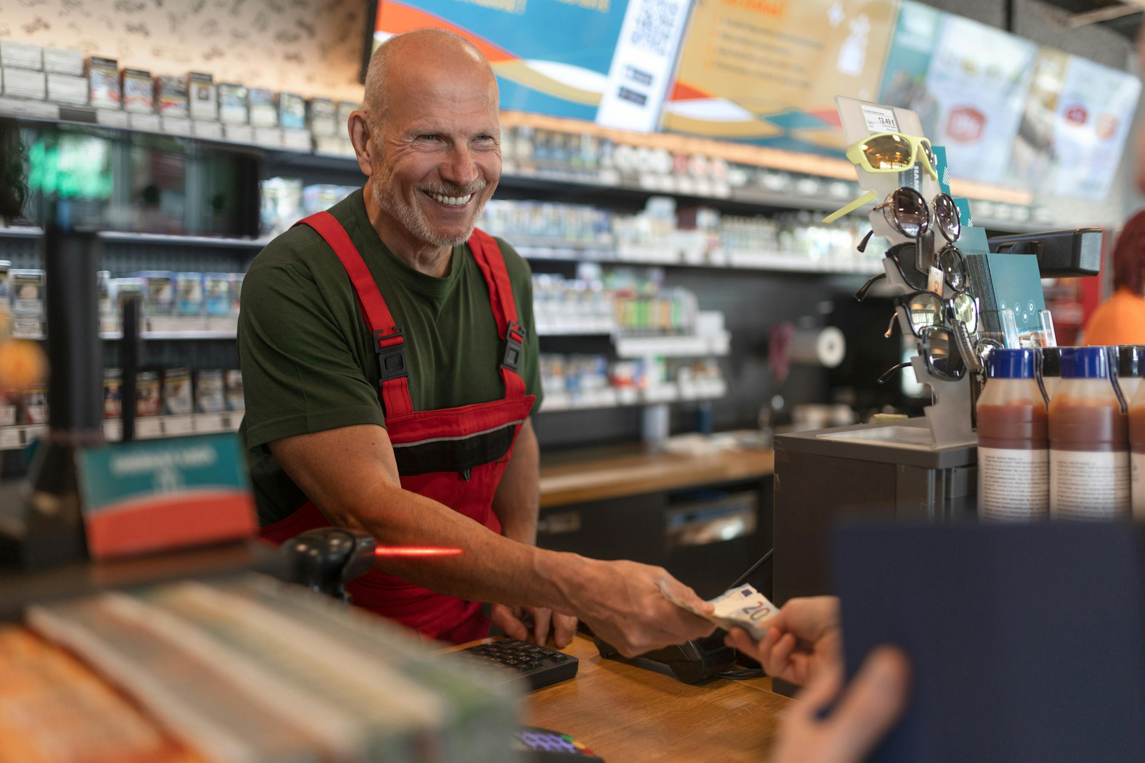 C store cashier smiling