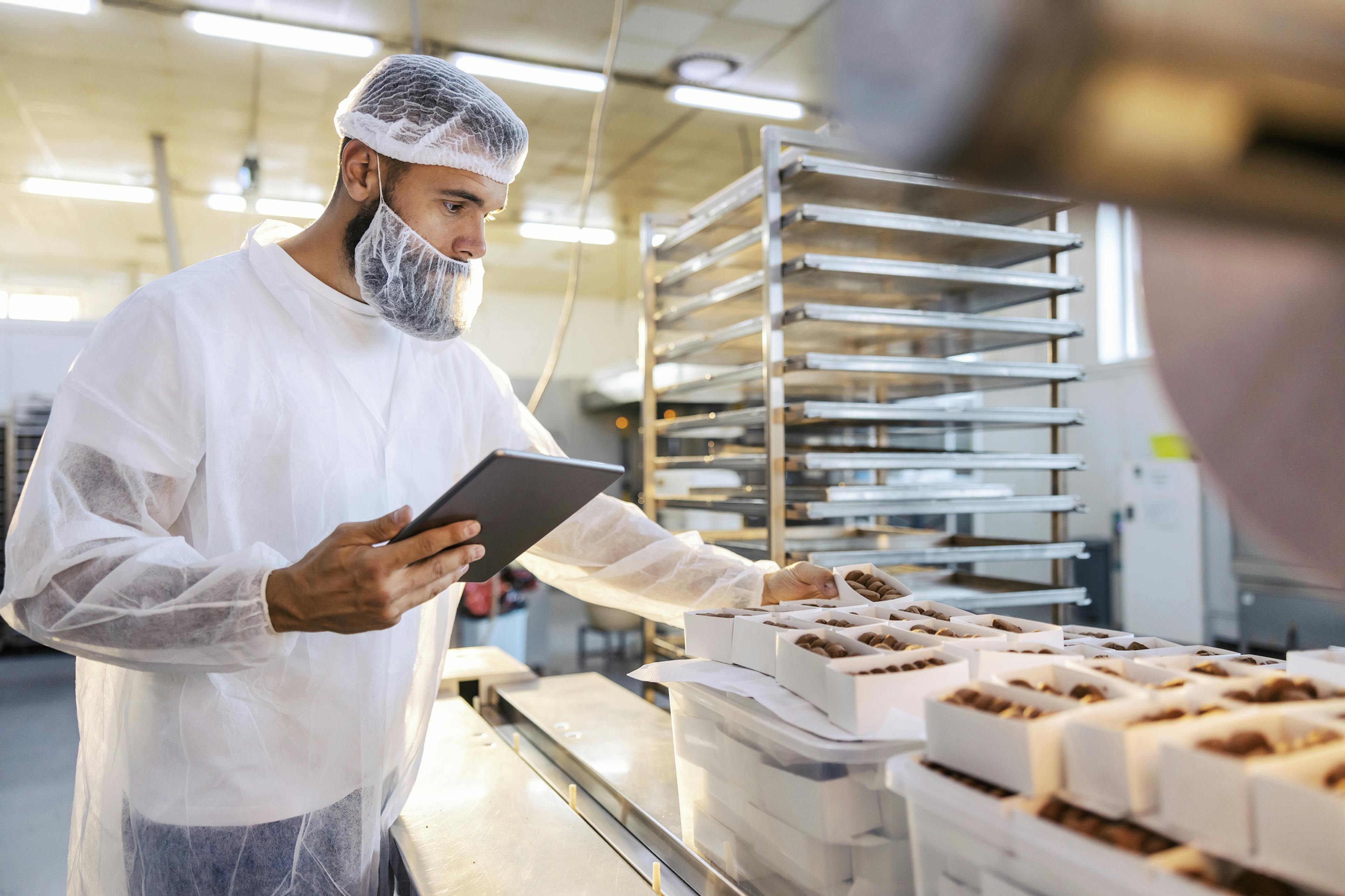 employee preparing baked goods