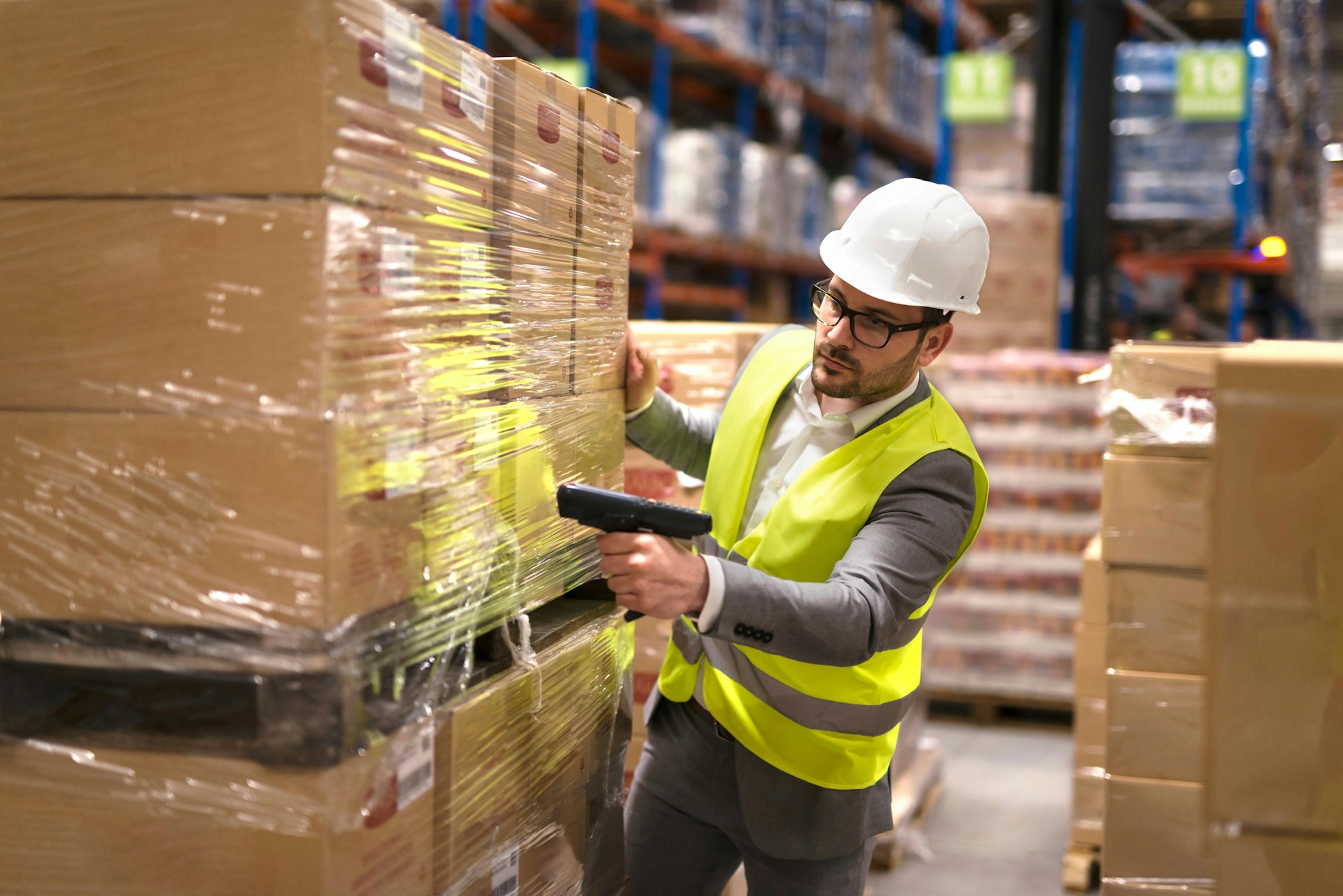 warehouse employee moving boxes