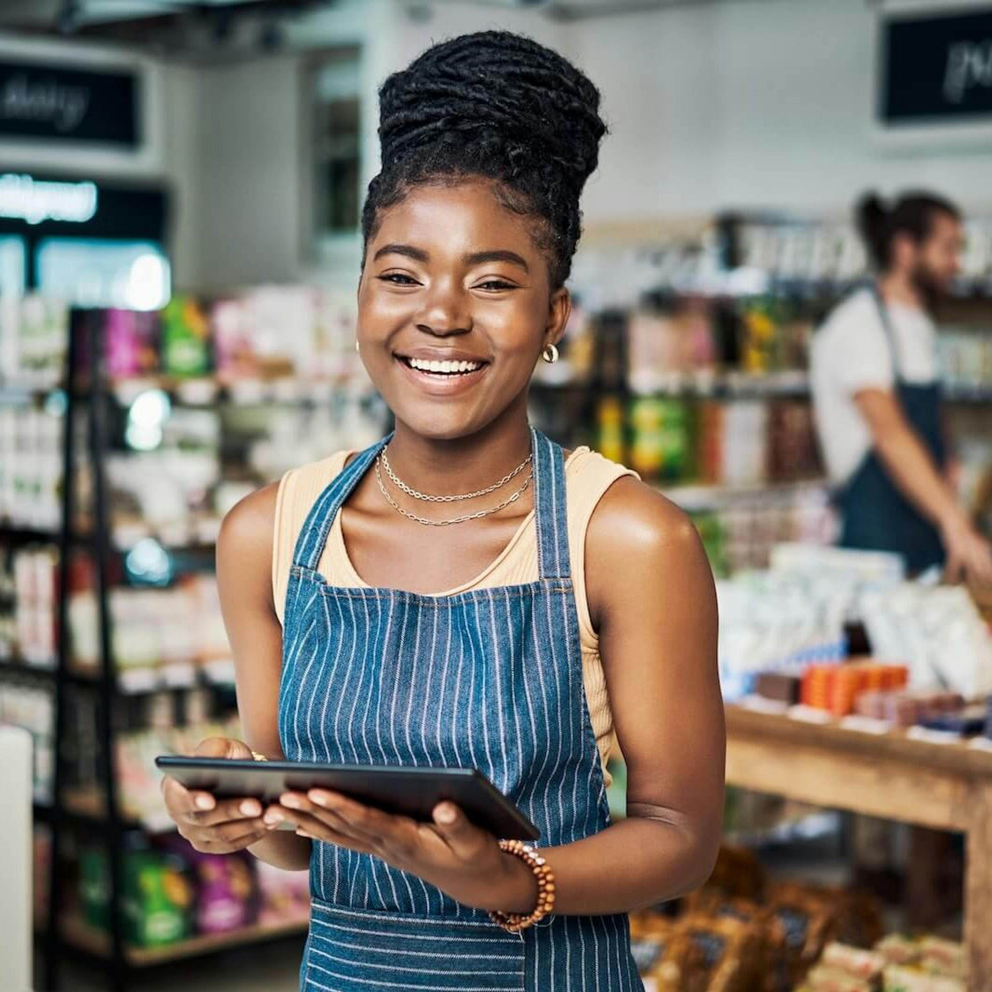woman holding a tablet at work