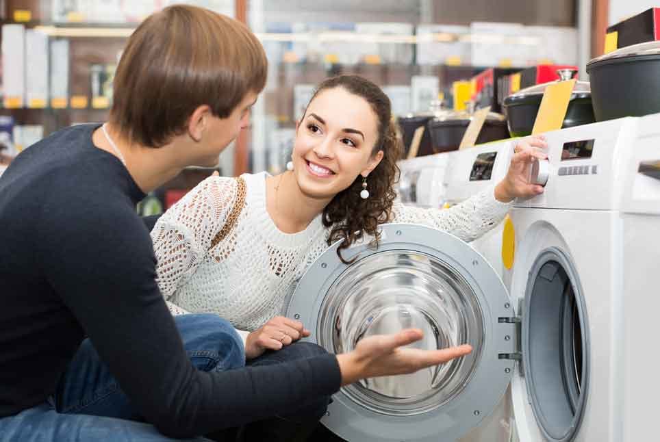 Retail customers looking at a washer and dryer