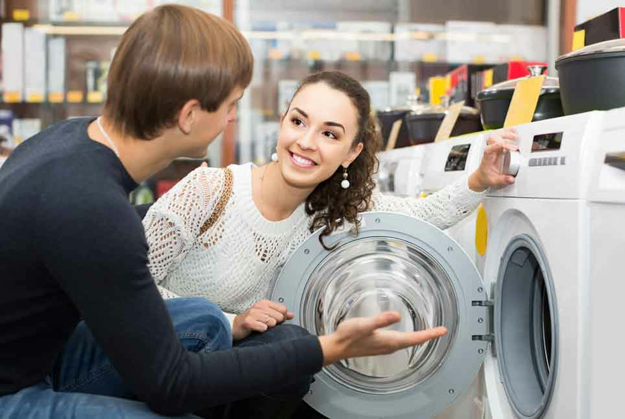 Retail customers looking at a washer and dryer