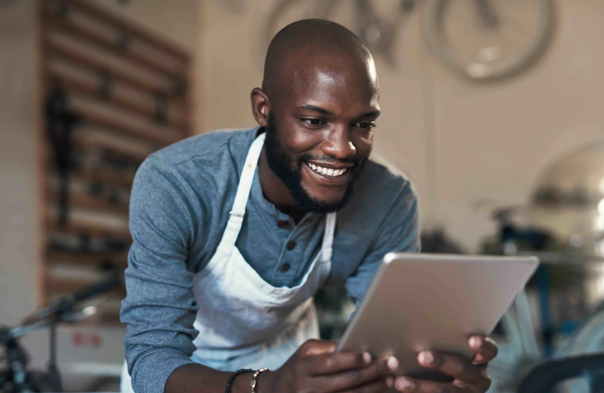 man in food store looking at iPad