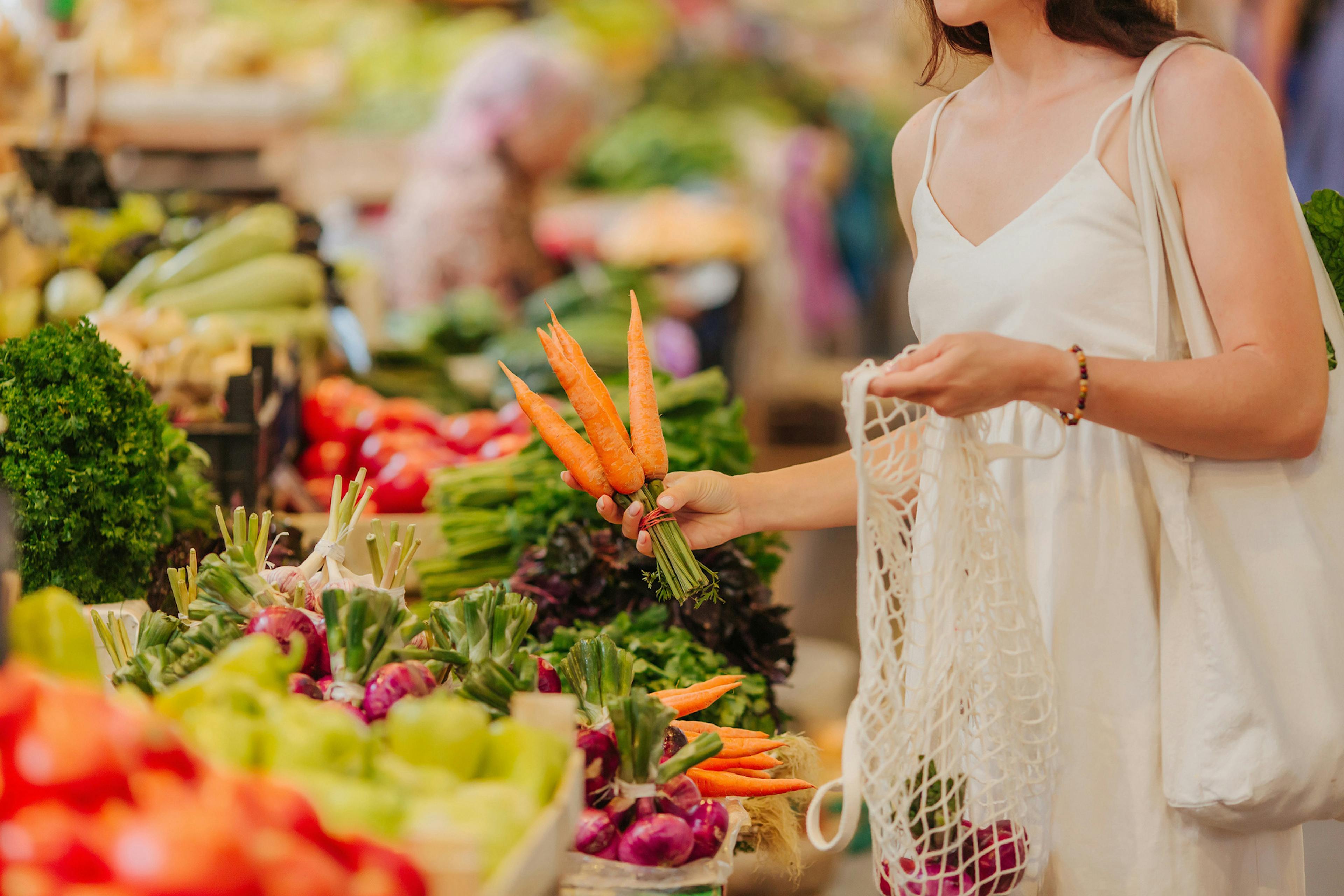 woman getting her produce