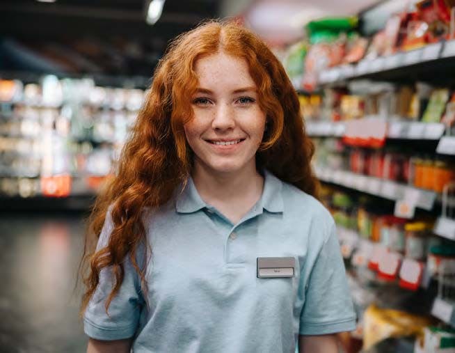 Employee smiling in aisle