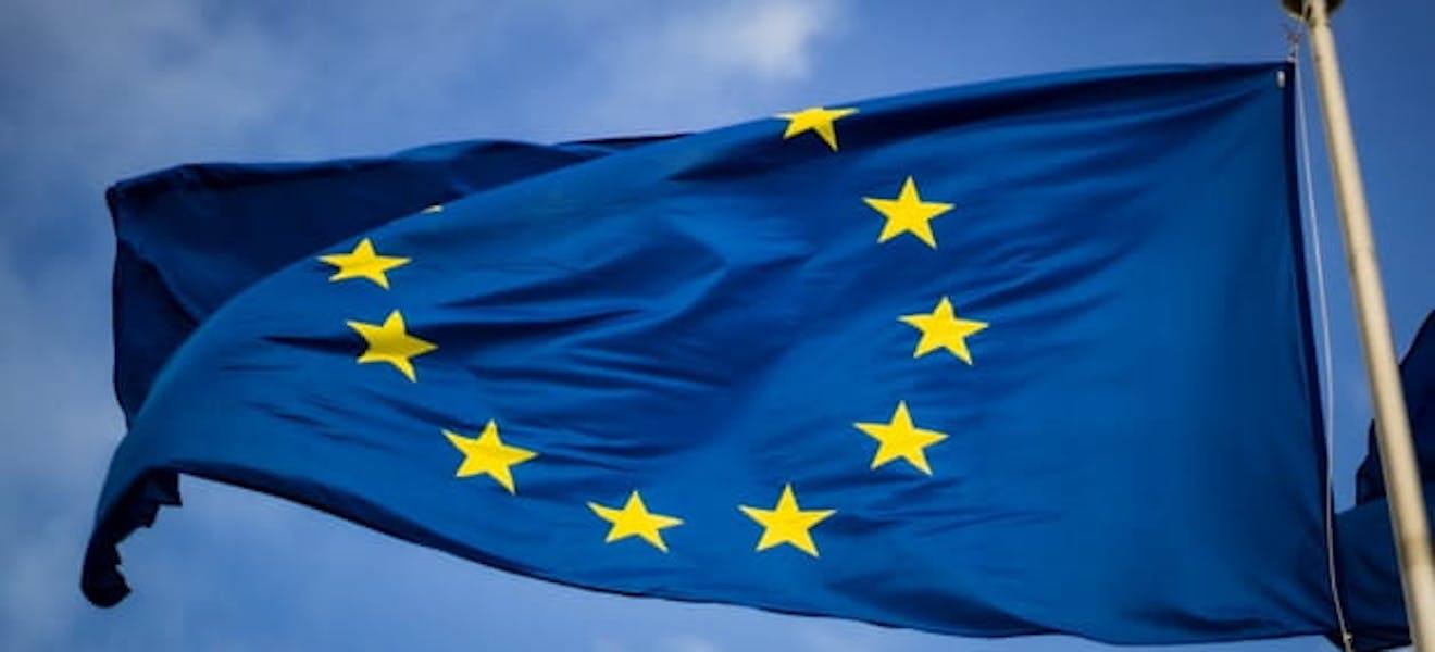 European union flag fluttering against sky