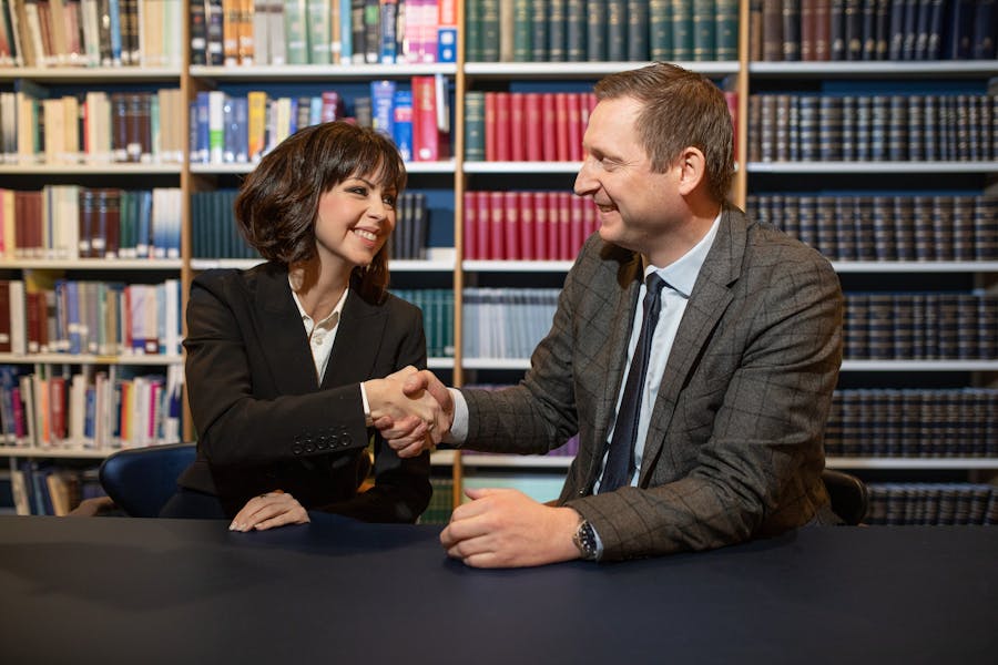A photo of Margrét Anna Einasdóttir, founder and CEO at Justikal, and Benedikt Egill Árnason, managing partner at LOGOS legal services