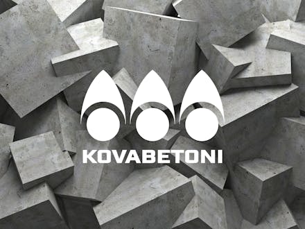 Kovabetoni's logo in front of a picture of a concrete wall