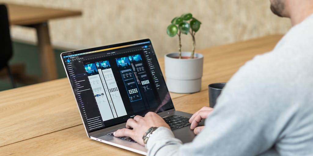 image of a back angle, of a ui/ux designer designing websites with figma