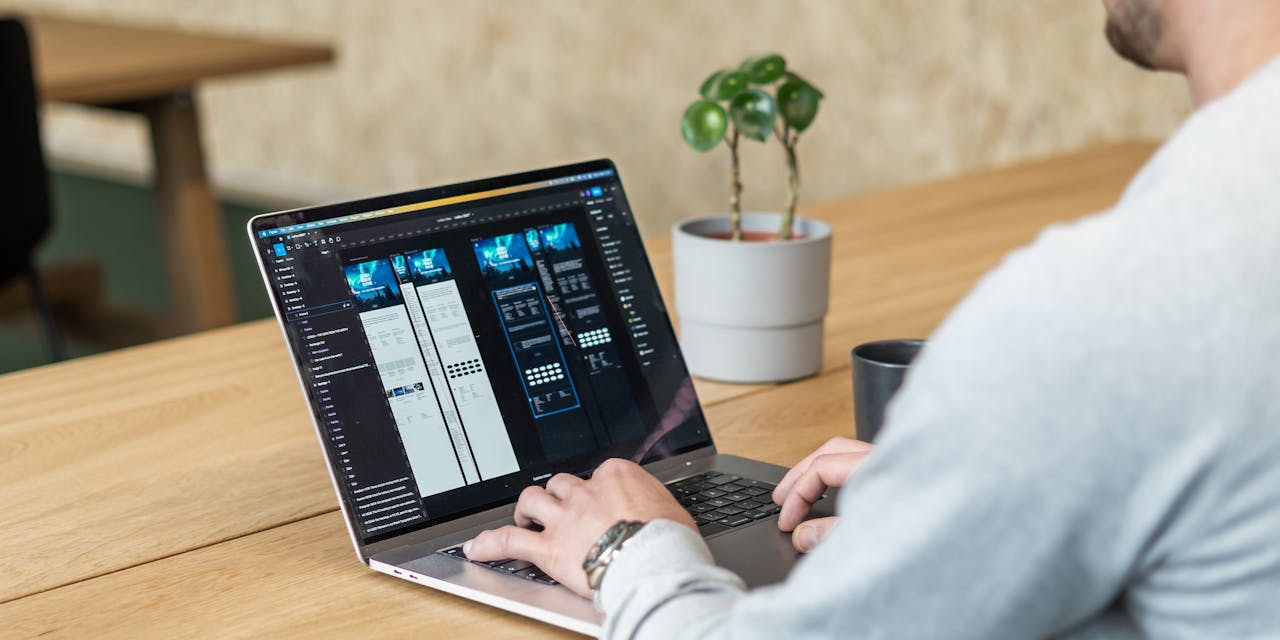 image of a back angle, of a ui/ux designer designing websites with figma