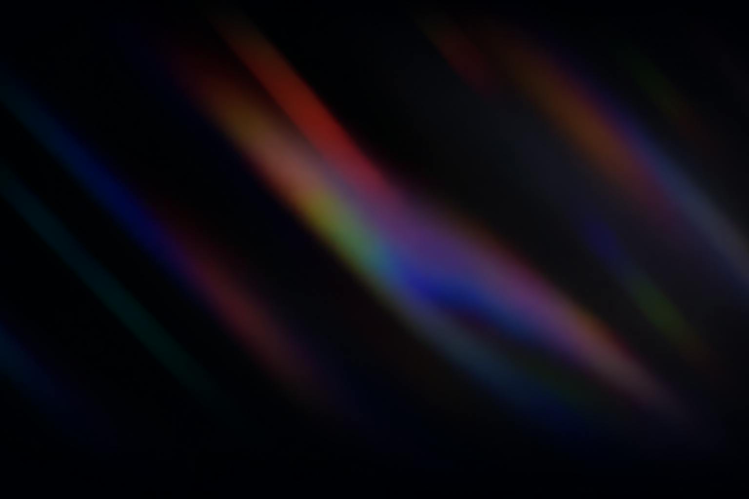 Revontulen värejä mustalla taustalla