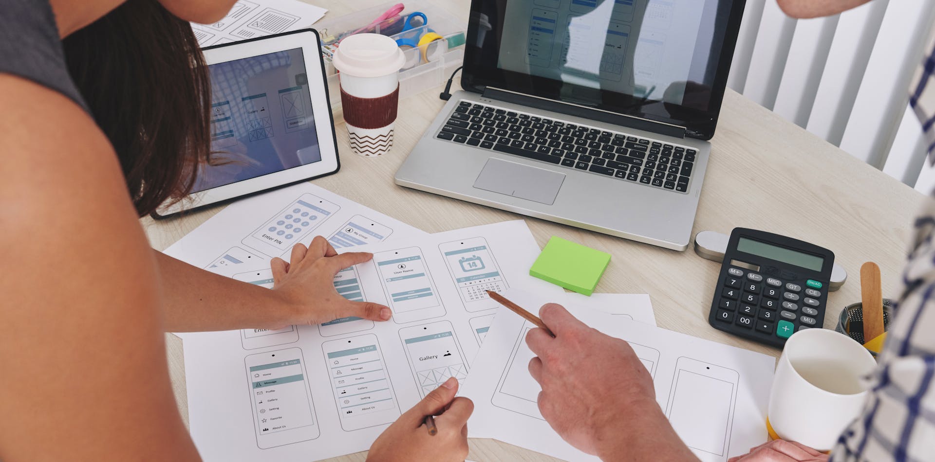 UX and UI Designer reviewing wireframes and ensuring design support information hierarchy
