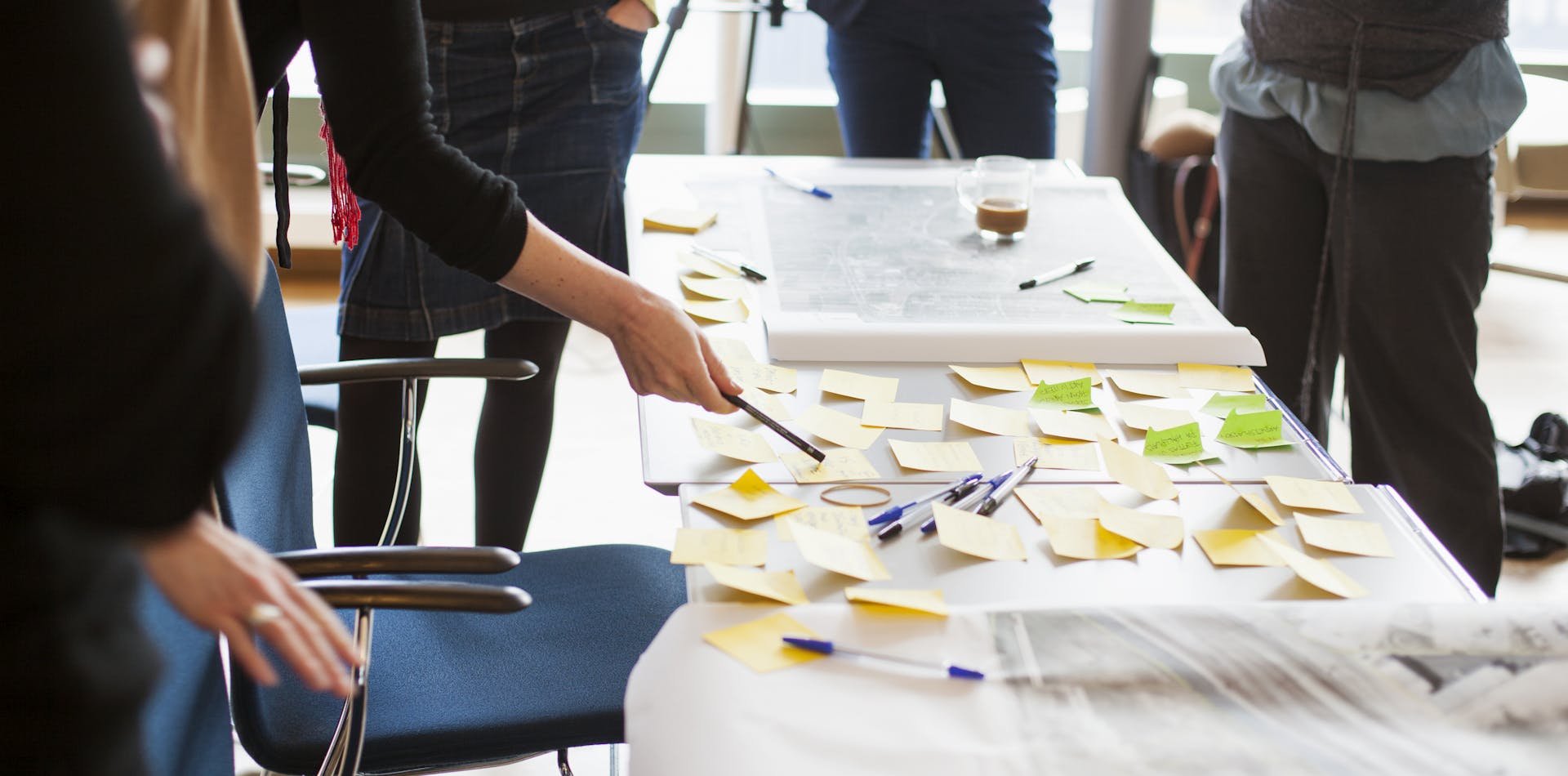 Team using post-its to strategize UX