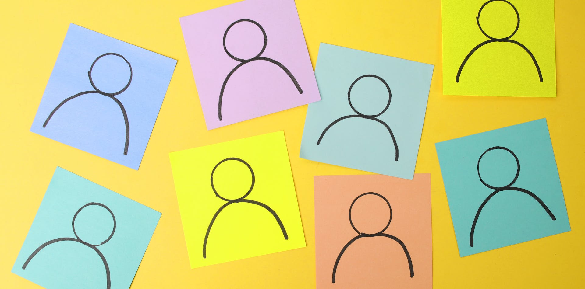 Outline of person drawn on various colored post-its representing different customer personas