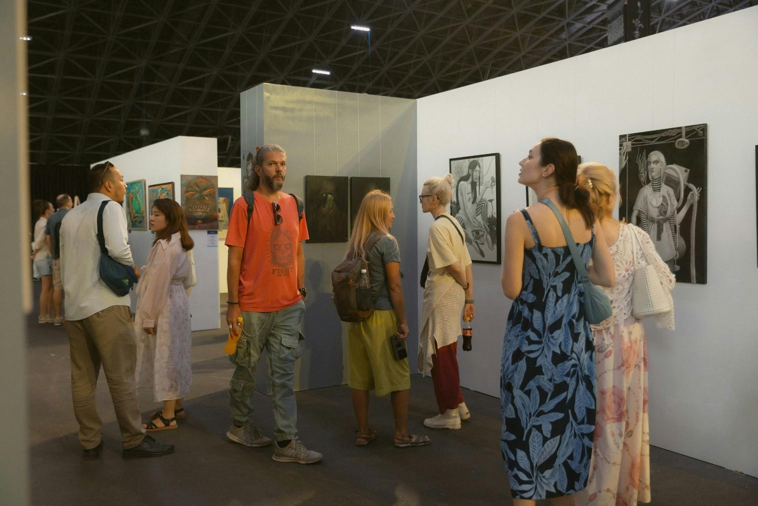 Visitors admiring work by graphic artist Dariya Kanti