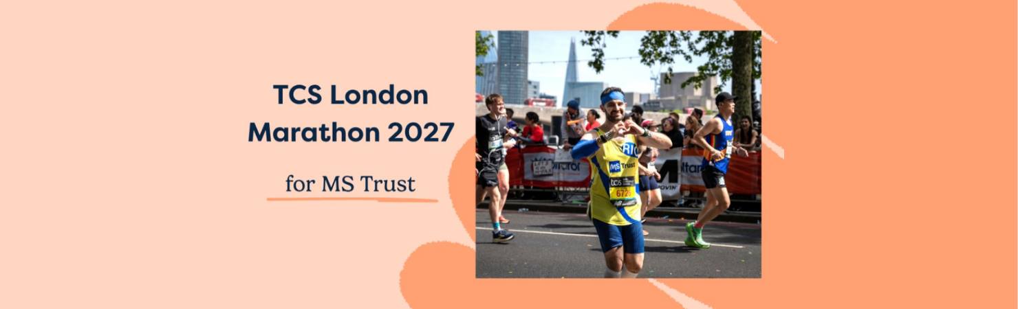 MS Trust runner taking part in the London Marathon, wearing a charity vest and making a heart shape with their hands.