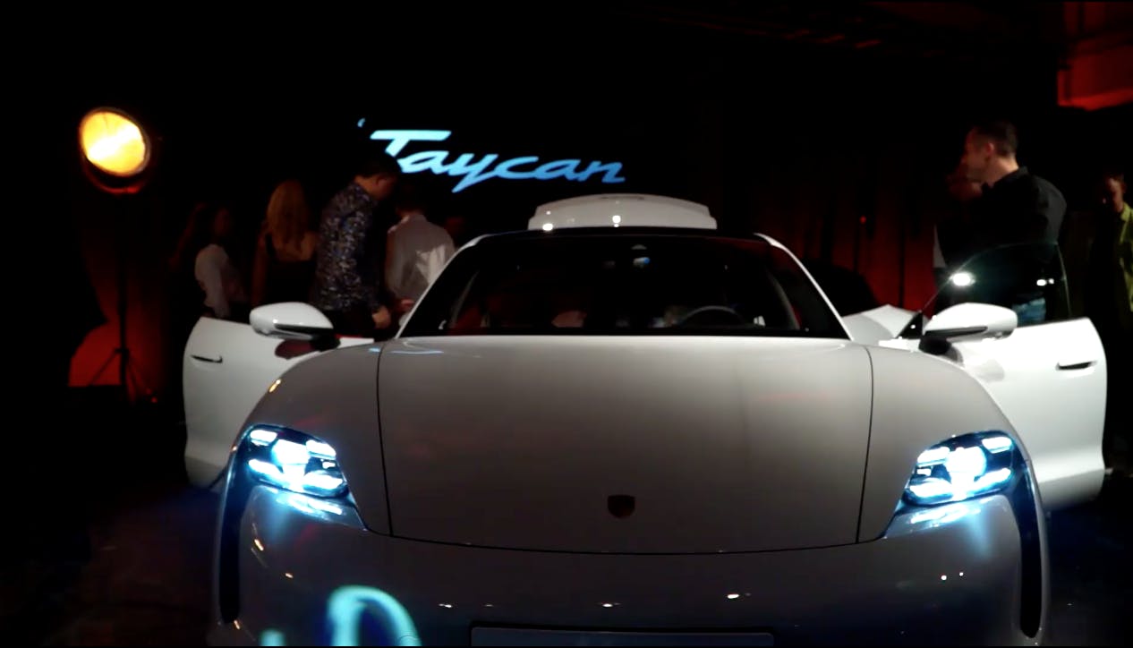 White porsche taycan at car launch.