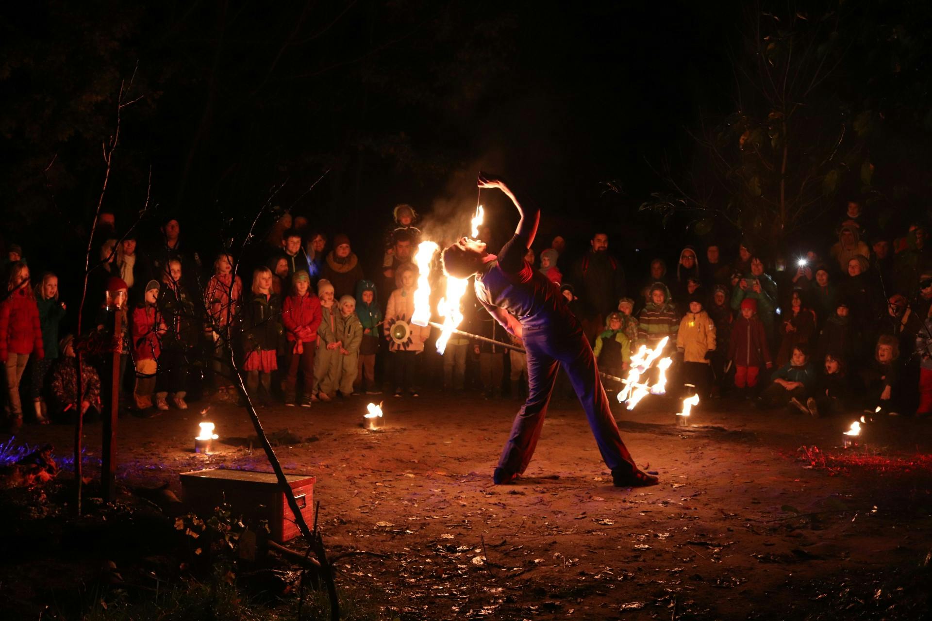 Fireeating at a fireshow in front of kids. 