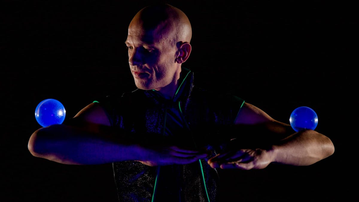Walkact with crystal balls and contact juggling.