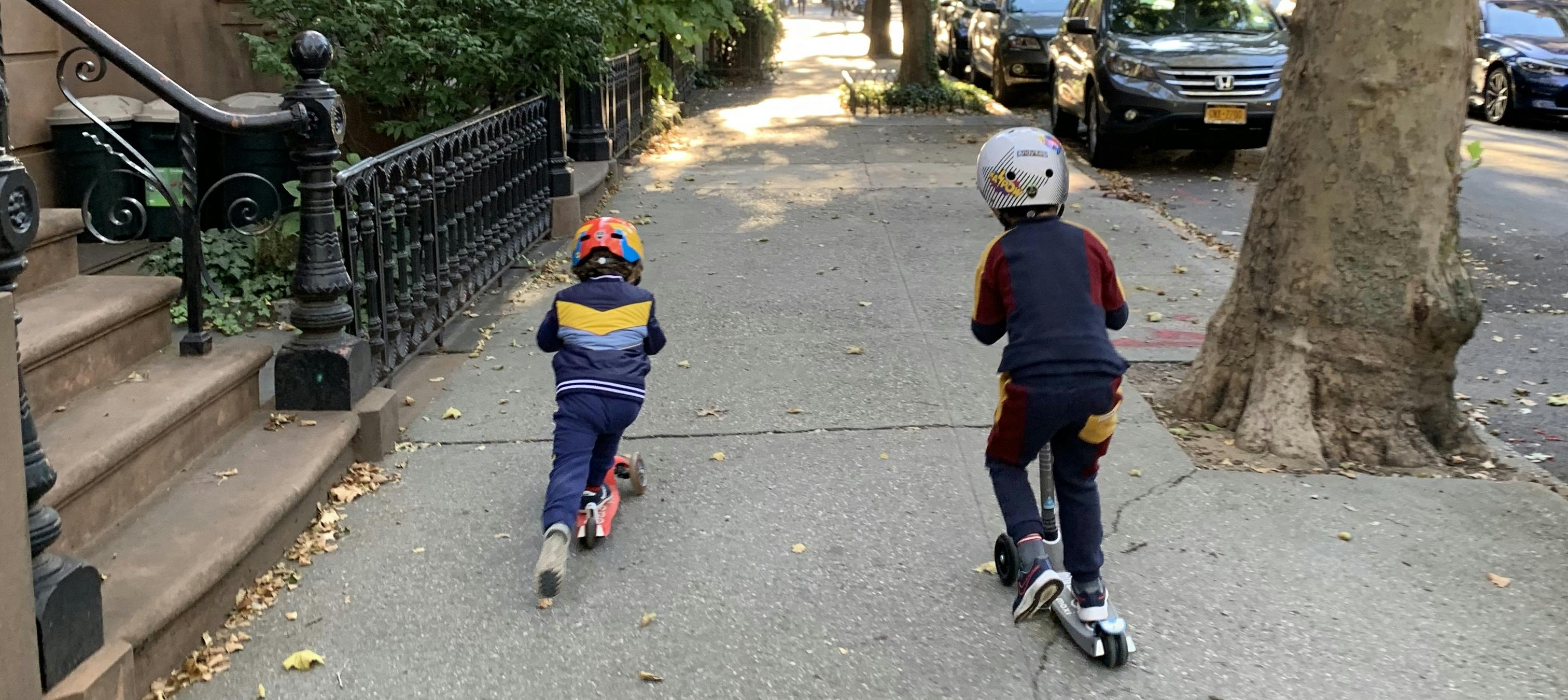 Children riding on scooters