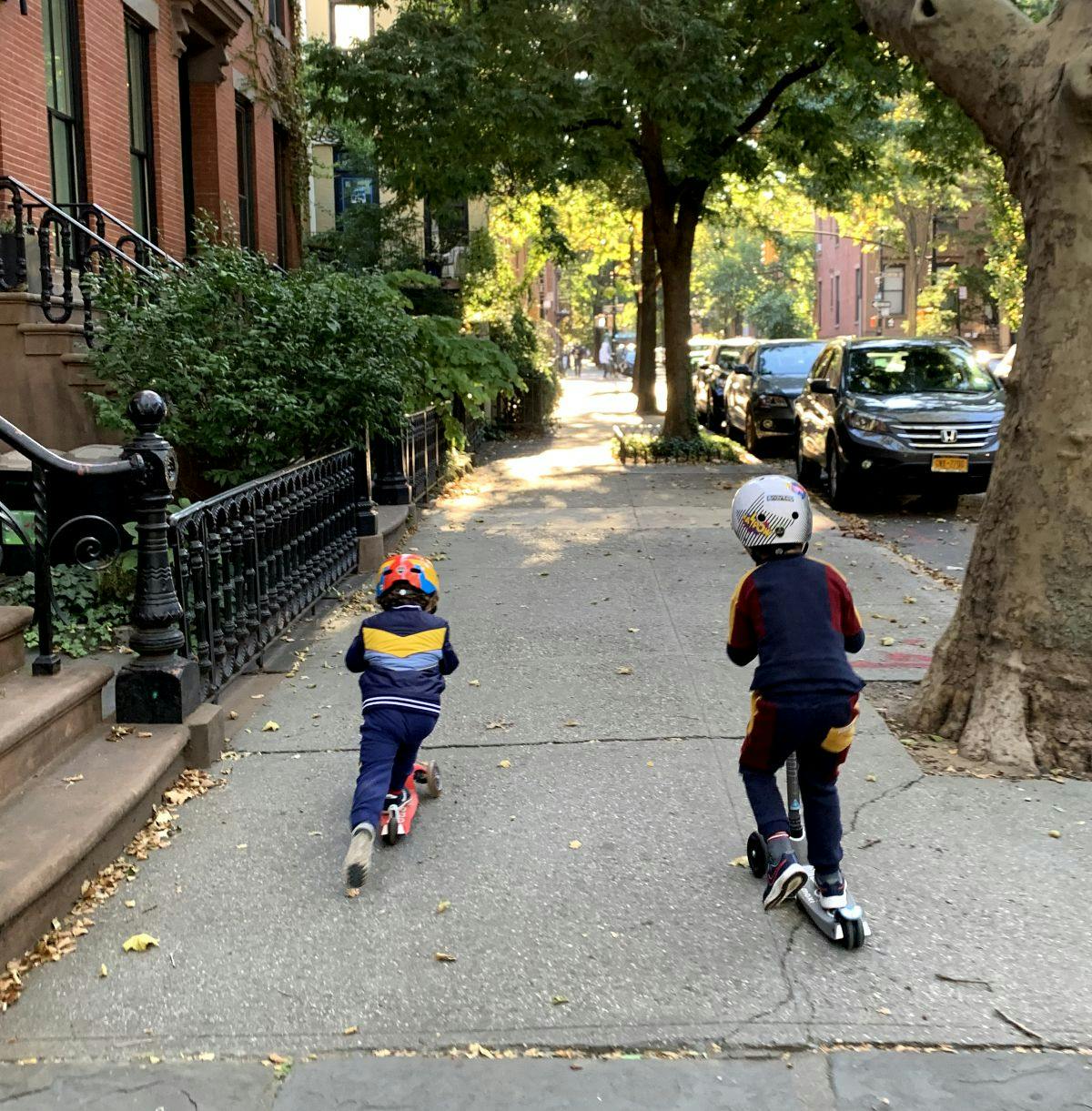 Children riding on scooters