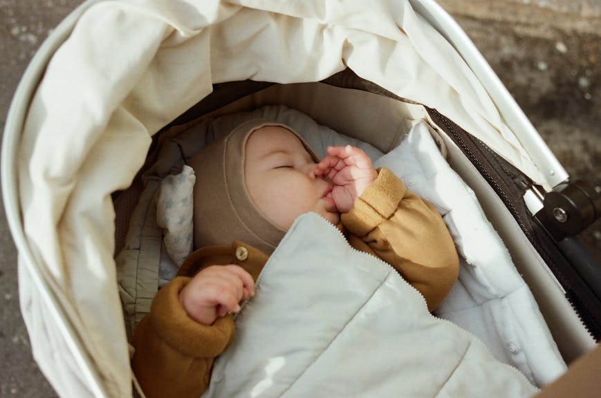 baby sleeping in bassinet