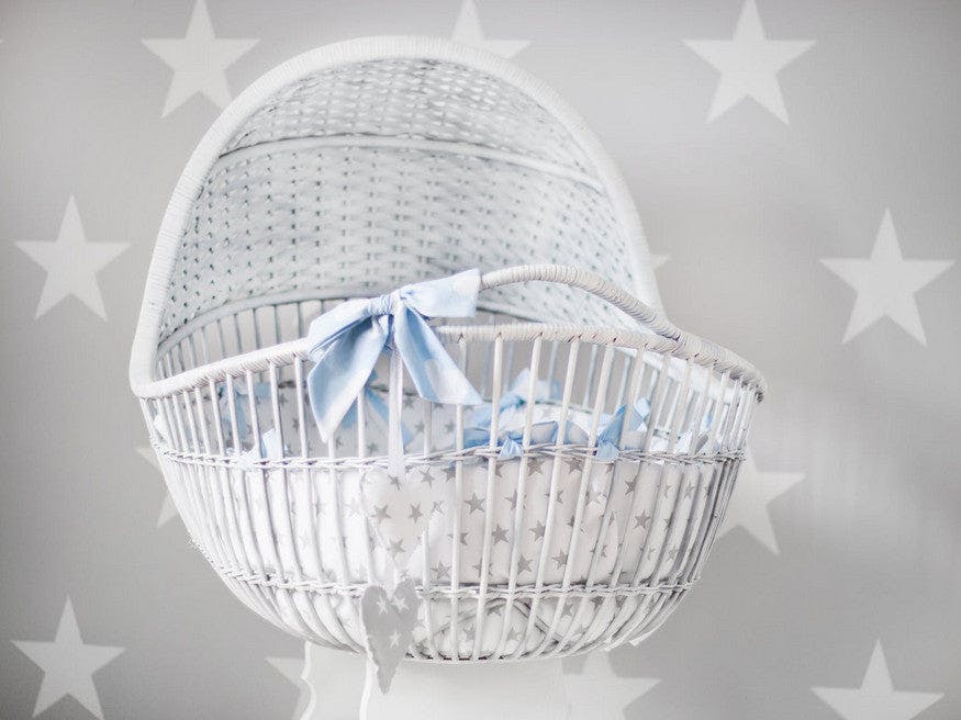 bassinet wrapped in a blue bow