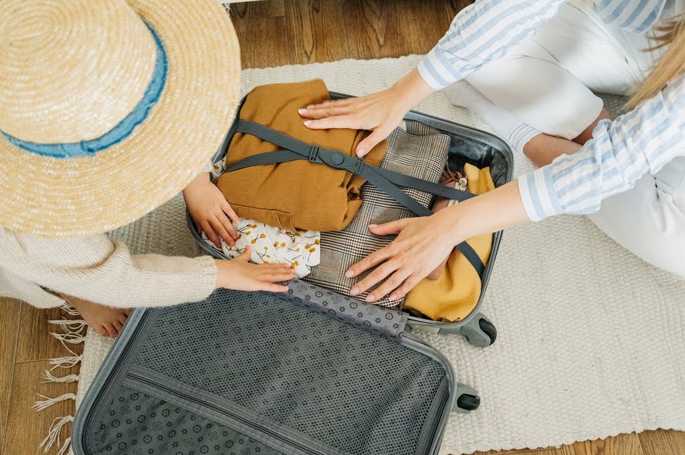 packing a luggage bag in the bedroom for vacation