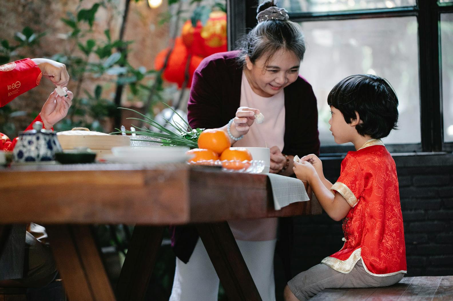 mom and toddler eating at a sushi restaurant