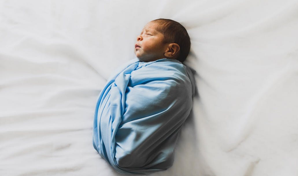 baby in swaddle sleeping