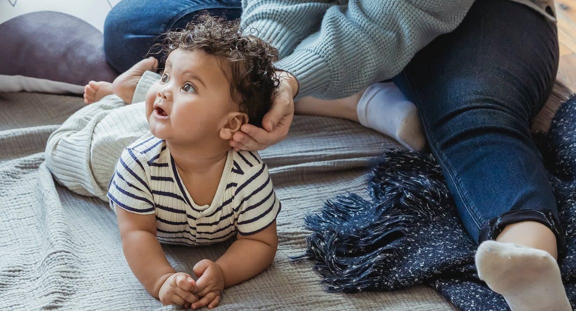 baby doing tummy time on the floor