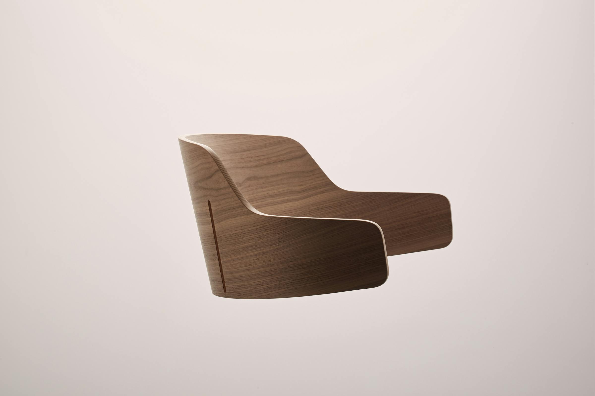 Detailed shot of a wooden backrest of the Seley armchair by Frédéric Dedelley for HorgenGlarus