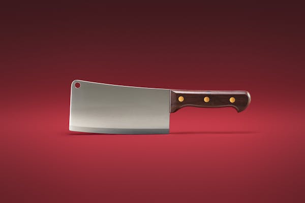 Packshot of a meat cleaver on a red background