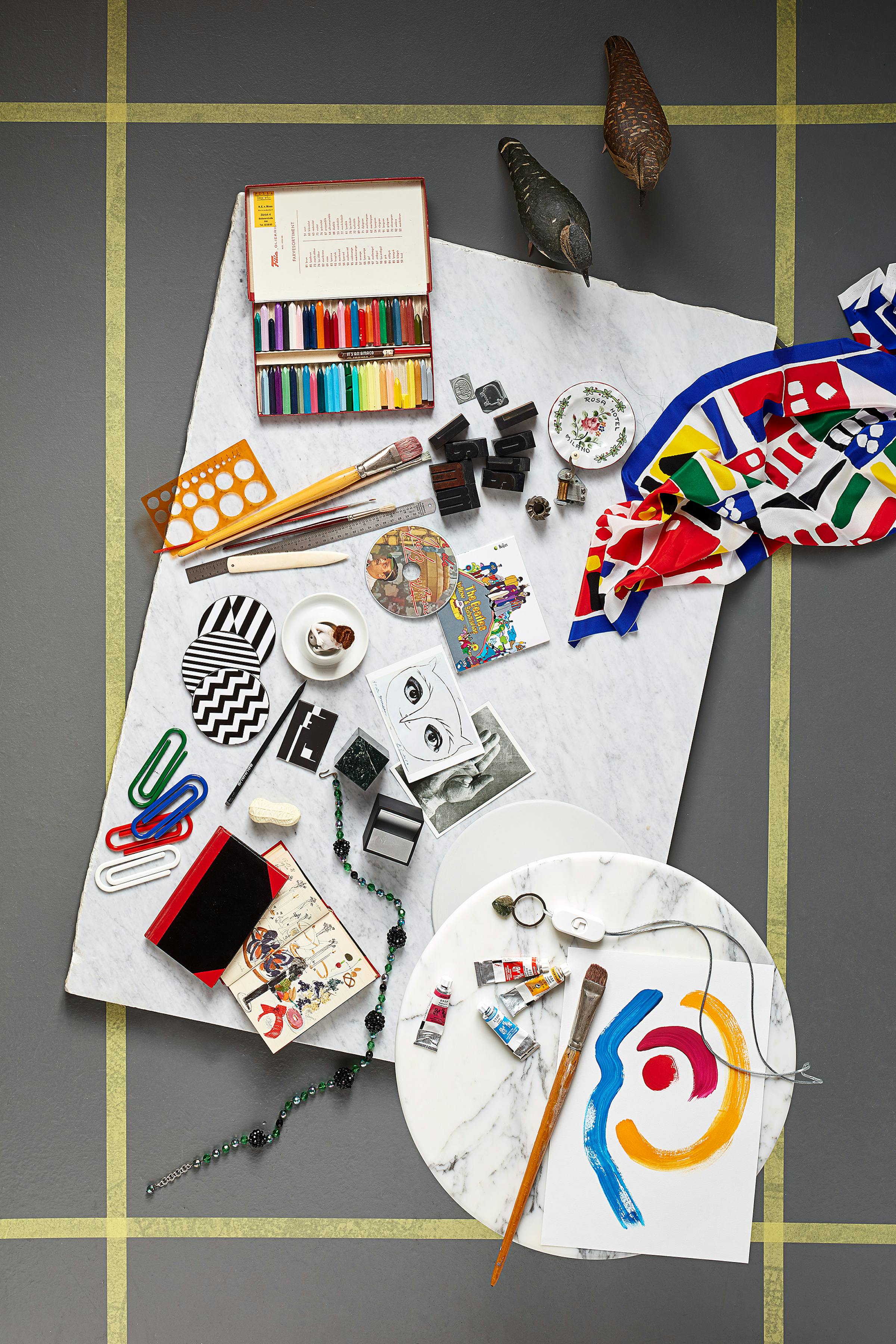 Bird's eye with a moodboard of of curated objects by graphic designer by Lora Lamm