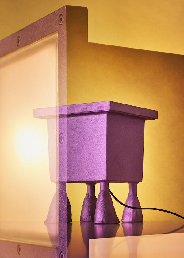 Multiple analogue exposure of the floor lamp "Big feet" by Italiand designer Mario Nanni in fornt of a vibrant yellow background