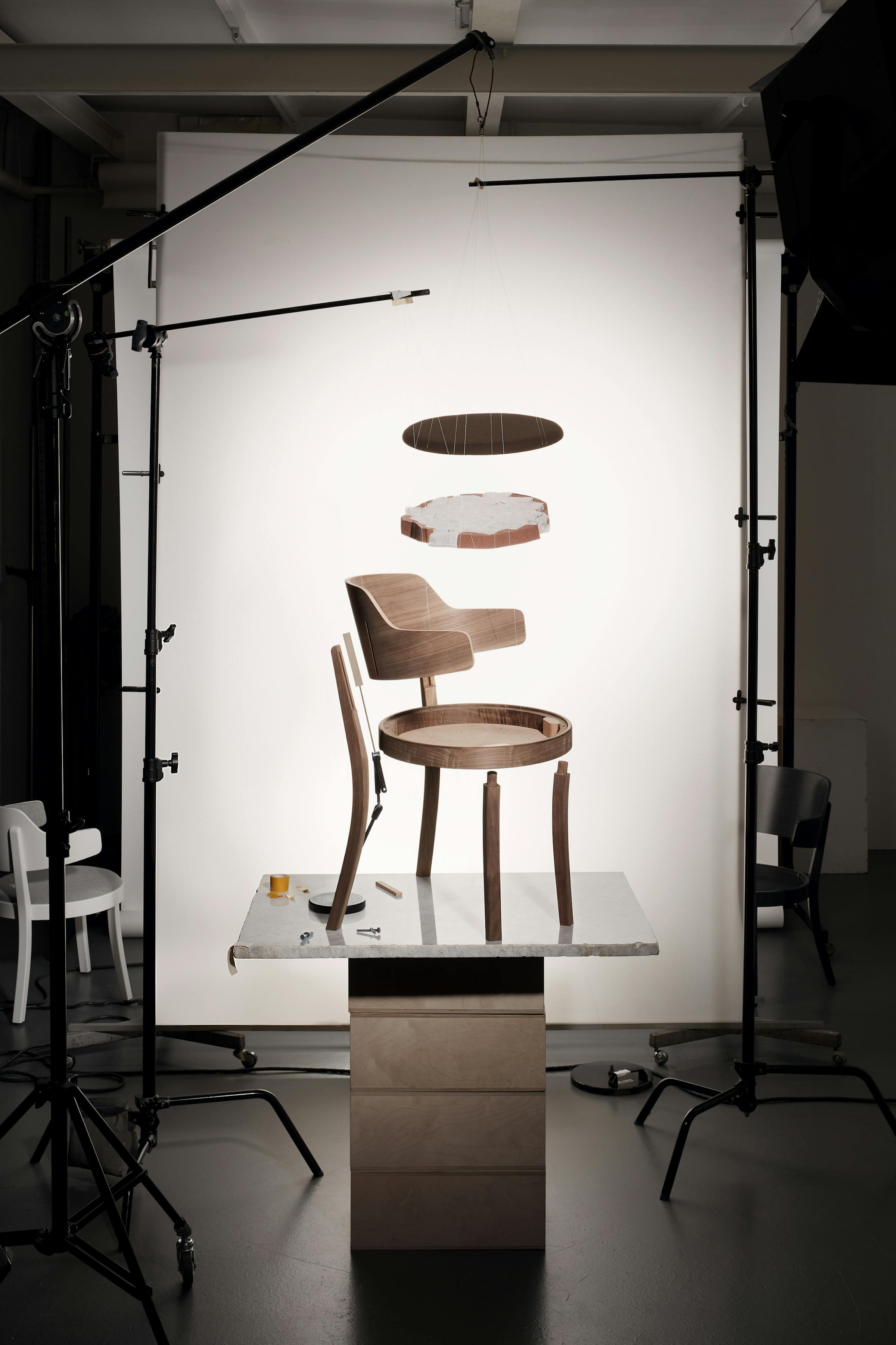 Technical explosion of the Seley armchair by Frédéric Dedelley for HorgenGlarus on a marble base and against a white background