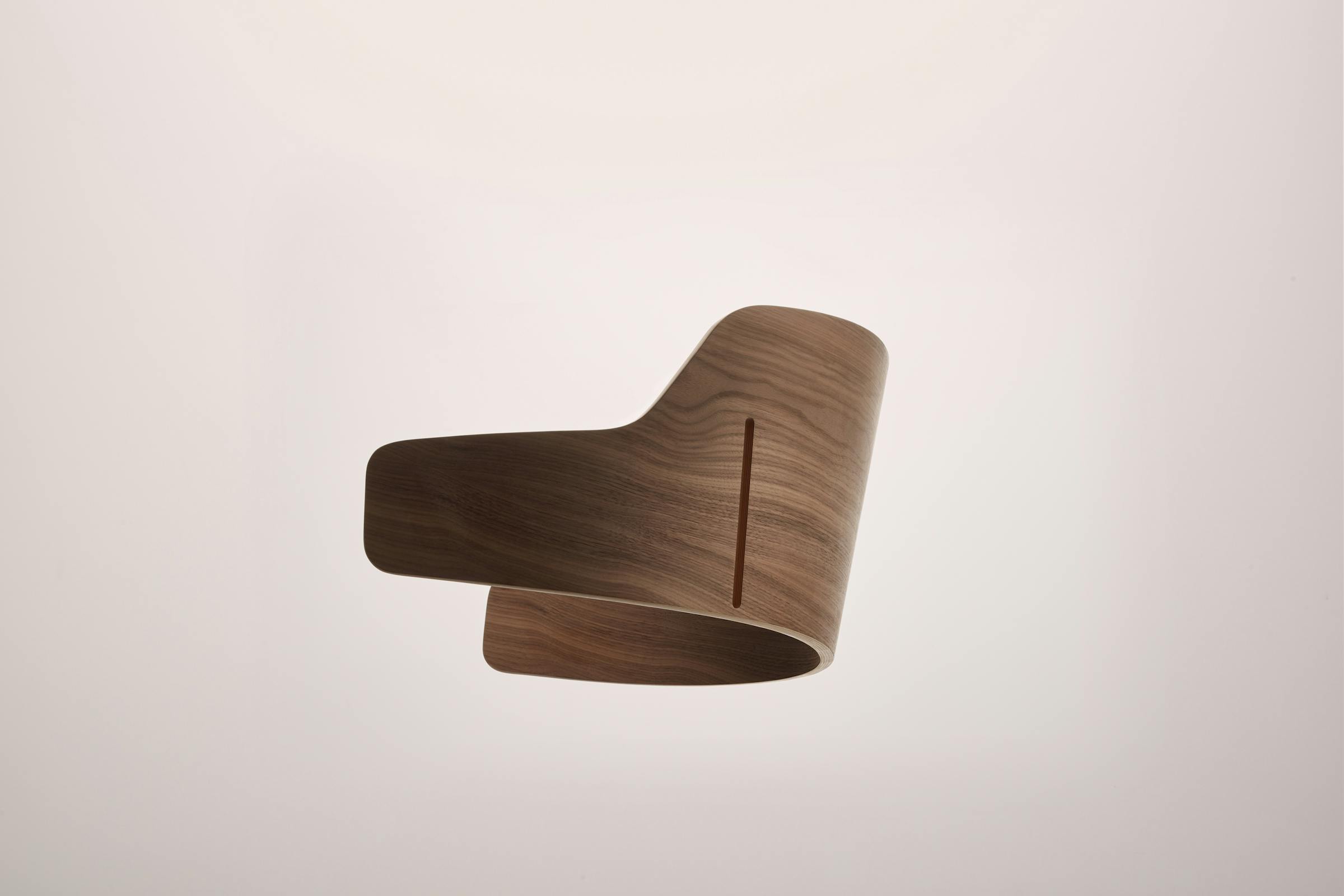 Detailed shot of a wooden backrest of the Seley armchair by Frédéric Dedelley for HorgenGlarus